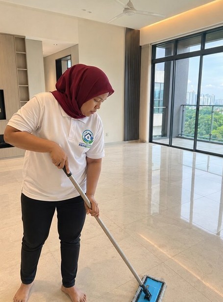 House cleaning service in Malaysia — Cleaning Services Primecare cleaner mopping a living room