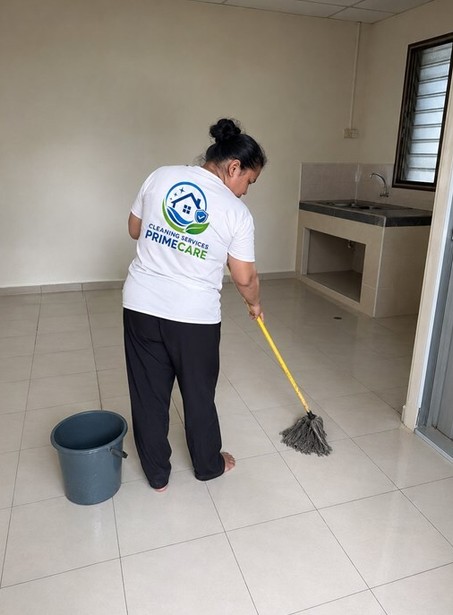 Part time maid cleaning in Malaysia — Cleaning Services Primecare cleaner mopping a kitchen