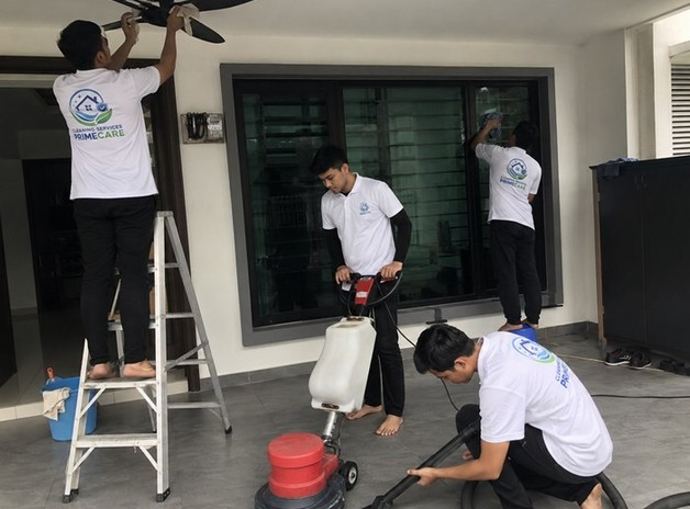 Post renovation cleaning in Malaysia — Cleaning Services Primecare crew buffing floors