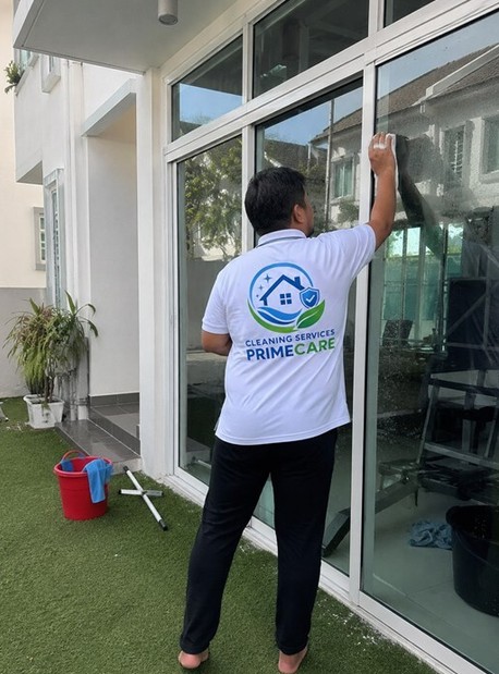 Cleaning Services Primecare technicians cleaning tall exterior windows at a landed home